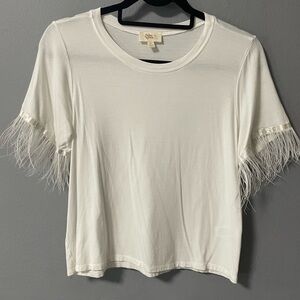 If She Loves ostrich trim short sleeves white shirt. Size Medium